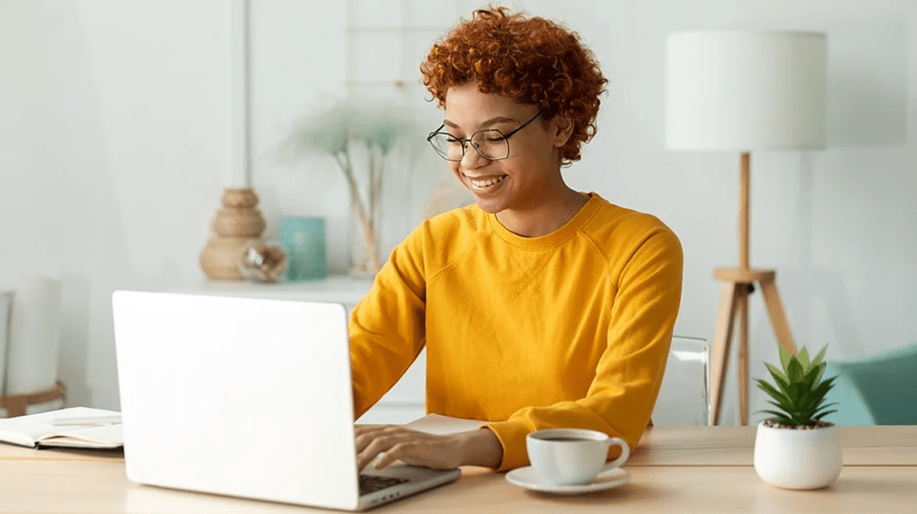 QA/RA program , woman sits on a laptop