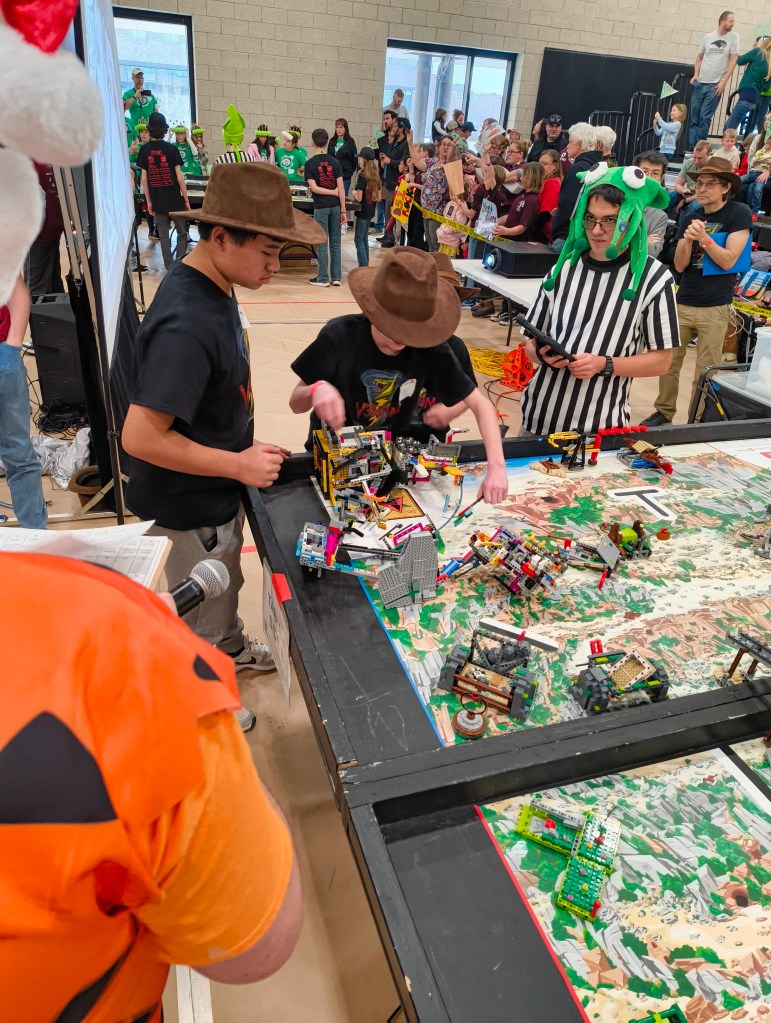 Two young future engineers craft their LLEGO robots