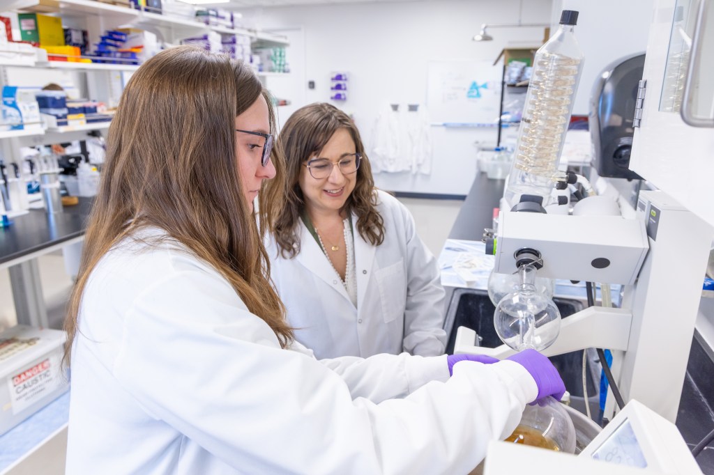 Chelsea Magin and student in the research lab.